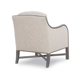 Wood frame arm chair with cushions. View from the back