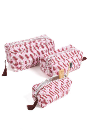 Inner Child block print toiletry bag with wipeable plastic liner.
material: 100% Cotton (filling and exterior) with a wipeable plastic liner 
• Dimensions:
 Medium (9" x 4.5" x 5" inches)