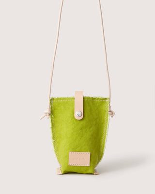 Kiwi lime cross body bag with tan leather strap latch and label by Graf Lantz