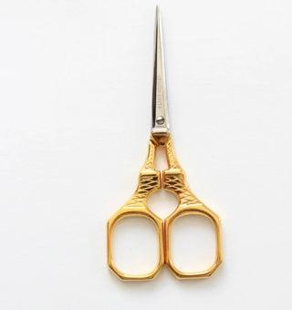 Expertly crafted in Italy from hard-tempered steel and covered with a thin layer of 24-karat gold, the Paris Scissors are a reproduction of a 19th-century pair celebrating the completion of the Eiffel Tower in 1889. A perfect gift for a francophile! With their pointy and sharp blades, they easily cut through textiles, ribbon or paper – perfect for both detailed and simple cutting. Each pair is etched with Studio Carta logo and is packaged in a letterpress paper label. 

Product Details:

Height: 4” (10 cm)
