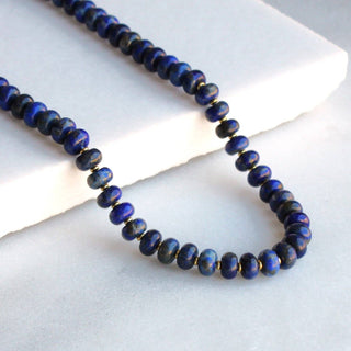 This lapis beaded necklace by The Silver Wren shimmers with deep blue tones and golden natural lapis.
5x8mm beads 
Gold Filled lobster clasp •Beaded by hand just for you Water friendly