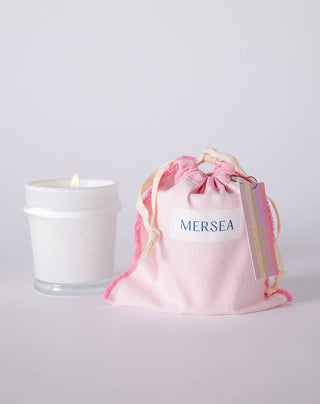 COCONUT SUGAR candle by Mersea with scents of coconut, amber, vanilla. Inspired by the calm feeling we always look to the Our classic 6.5 ounce candles are poured in sheer white glass vessels that can be repurposed. Candles are thoughtfully packaged in a reusable canvas bag.