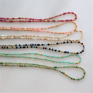 Seed beads mixed in  a random pattern 18” length. Perfect for layering over gold jewelry to add a pop of color. 
