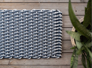 Fog gray and navy rope woven doormat.
