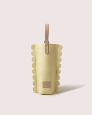 Graf Lantz wine carrier in lemon merino wool felt with a scalloped edge and light natural leather handle and label