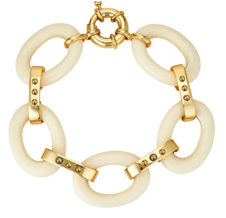 Ivory Link Bracelet by Asha.
14k gold dipped with 14k gold dipped cabs and faux ivory chain link bracelet with spring ring closure.

8" Length