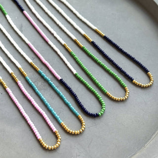 Colorful seed bead necklace with gold colored beads 16” length 