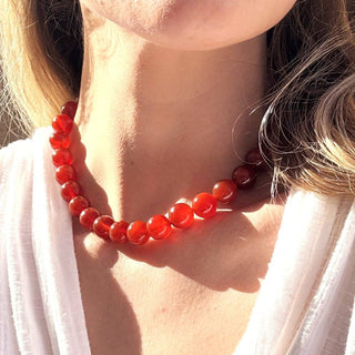 The Silver Wren natural carnelian, 12mm bead necklace•Gold Filled lobster clasp •Beaded by hand just for you .
Length is 16 inch plus an optional 2 inch extender. Water friendly