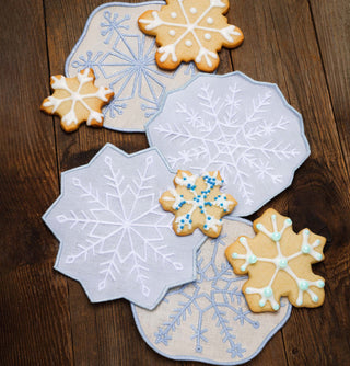 Delicate, detailed, and winter-perfect. This set of four 100% linen cocktail napkins by Piecework features embroidered snowflakes—each one a little different, just like the real thing. These winter-ready coasters are a frosty finishing touch for holiday hosting, après-ski snacks, or any snow-day sip.

 