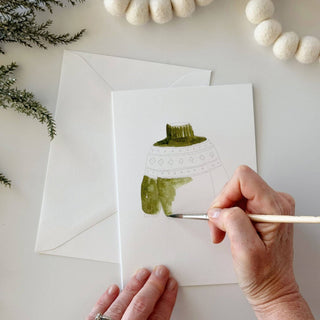  Warm and Cozy note cards by Emily Lex Studio includes a sweater, a candle, a hat and mittens, a mug of cocoa — four small comforts of the season, sketched on watercolor paper and ready for your colors. Simple instructions included. Details: - set of eight paintable notecards + envelopes - two of each illustration lightly sketched for you to paint - blank inside - 5" x 7" - Printed on 120lb watercolor paper