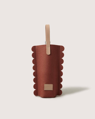 Graf Lantz wine carrier in rust merino wool felt with a scalloped edge and light natural leather handle and label