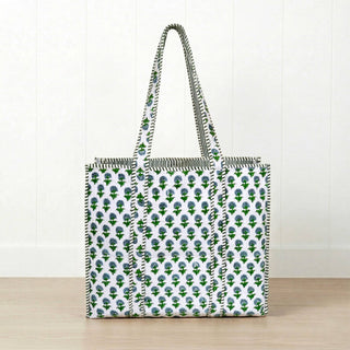 Our new Hydrangea Tote Bag by Amelia Rose  is guaranteed to catch your eye with its vibrant color and stunning design. Handcrafted for both style and durability, this tote is perfect for everyday errands, trips to the gym, playground adventures, and everything in between. Featuring a green floral pattern with blue accents and chic interior stripes, it’s made from 100% cotton for a soft, natural feel. -100% cotton -17" W x 15" H -snap closure
