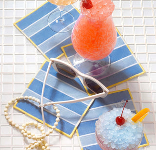 The art of a well-appointed afternoon. This set of four 100% linen cocktail by Piecework napkins is striped in cool blues and softened yellows, like loungers lined just so—made for spritzes, small talk, and staying exactly where you are. All afternoon.