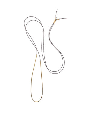 The long and thin silk cord Dorado necklace by Abacus Row is for the ultra-minimalist. Collected at the bottom, the gold-filled tubes create a clean eye-catching line of gold. For another look, slide these small tubes apart to create a dash of gold all around.

Length – adjustable, up to 30"

Materials – 14k gold-filled beads and findings, silk cord