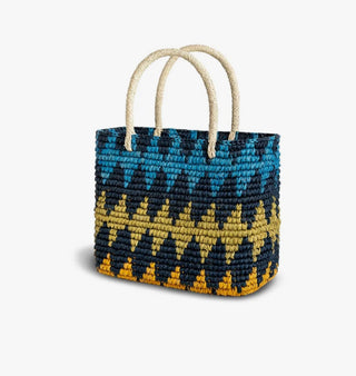 Each Greenpacha bag begins as a leaf and comes to life through ancestral handwoven techniques from Ecuador. This bag has a colorful geometric pattern. Sustainable, thoughtfully crafted, and naturally beautiful — no two are ever the same.

Size:
Width: 30 cm
Height: 23 cm