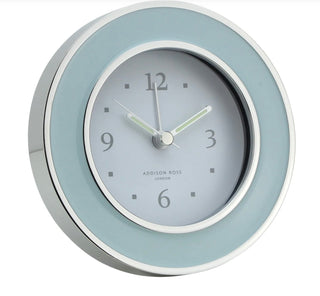 Light blue Enamel round shaped alarm clock with silver trim  by Addison Ross.