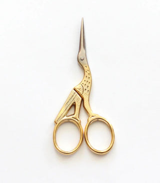 The Crane scissors have a lovely shape, with finely engraved details, they feature nickel-plated blades and gold-plated handles. A thin layer of 24 karat gold is applied to the scissors to have a beautiful gold finish that makes them shine! Perfect for cutting ribbon and other textiles, or embroidery or other detailed work without becoming dull. small size height 3 1/2”