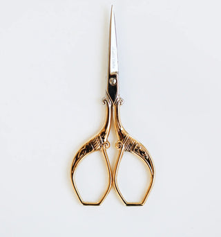 Expertly crafted in Italy from hard-tempered steel and covered with a thin layer of 24-karat gold, the Florentine Scissors easily cut through textiles, ribbon or paper – perfect for both detailed and simple cutting. An intricate leaf and floral design adorn the handle. 
Small size  - height  3 3/4”
