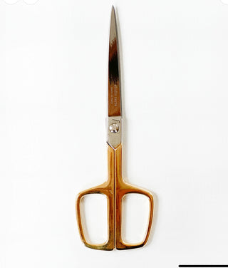  Our Office Scissors have a simple, modern shape and are crafted in Italy with hard-tempered steel with a 24-karat gold-plated handle. 