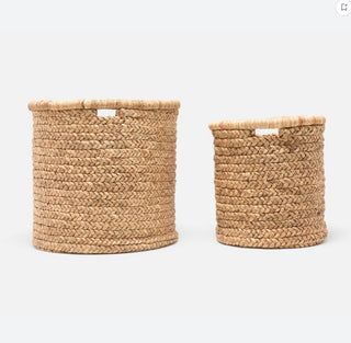 Round basket by Made Goods made from woven water hyacinth, featuring integrated handles and a contrastingly wrapped rim.

Dimensions: 25”D x 23”H
