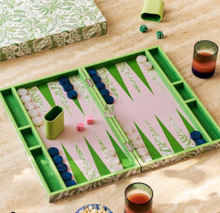 Lacquered backgammon set by Addison Ross.
The lacquered Palm Beach Green exterior and vibrant Pale Pink suede interior create a stunning visual, while mother-of-pearl effect chips, leather-and-suede shakers, four precision dice, and a classic doubling cube ensure every game feels indulgent. Measuring 47cm x 28.5cm, our green and white backgammon set is perfect for showing off on your coffee table or diving into a lively game night.