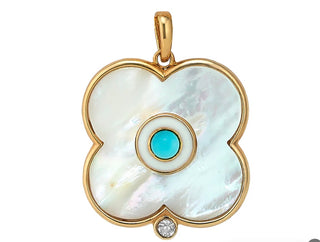 Asha 14k gold dipped mother of pearl and turquoise evil eye charm with white topaz is sure to be an eye catcher. Wear it on its own or layered with any of our other charms. Chain sold separately. Pictured here with the Clover Lariat.

1"