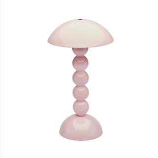 Addison Ross pale pink bobbin cordless table lamp.