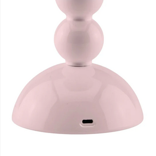 Close up of the power port for the Addison Ross pale pink bobbin cordless table lamp.