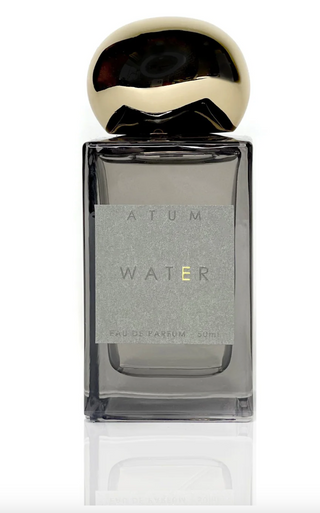 Perfume bottle labeled 'Atum Water' on a white background