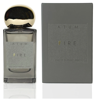 Atum grey glass bottle with amorphous gold top and elegant grey box with Atum FIRE written on the front in grey and gold.