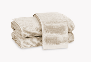 Matouk Aman Nude Towels folded towels with ribbed loop detail