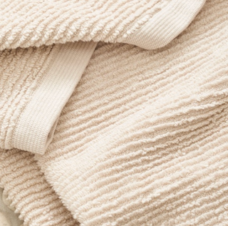 Close up of Matouk Aman nude towel