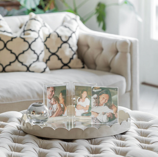 Addison Ross decorative tray with family photos on a coffee table in a living room setting.
