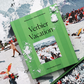 Piecework Puzzles 'Verbier Vacation' ski scene on a partially completed puzzle.