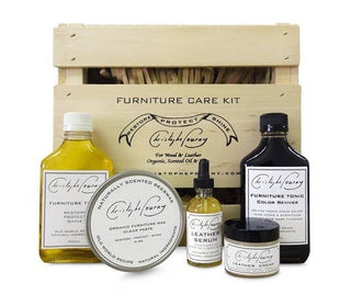 An assortment of 5 wood and leather care products by Christophe Pourny to maintain most surfaces in the home. Tonic, reviver, paste wax, leather serum and cream. All housed in a re-usable wooden crate. 