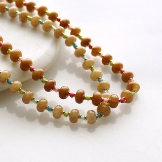 Warm, sun-washed beads by The Silver Wren in earthy brown tones with accents of bright energizing colors, hand-strung for effortless layering.
natural dyed jade, 5x8mm •Adorned with 14kt gold filled accents •Beaded by hand just for you Water friendly •16 inch length plus a 2 inch extender for up to 18 inches.
