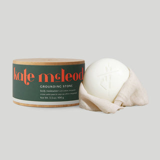  
The Grounding Stone Body Stone by Kate Mc Leod combines woody vetiver and zesty bergamot for meditative focus and balance. This luxury lotion bar intensely nourishes dry skin for a deep conditioning body treatment that leaves skin visibly soft, supple, and glowing. Concentrated Moisturizing Formula: The Body Stone is a highly efficacious cocoa butter concentrate chock full of fatty acids to deeply moisturize dry skin. Our Starter Kit includes our signature reusable bamboo canister for easy storage.