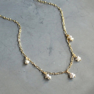 Dainty gold filled necklace with shell pearls. 16” length 