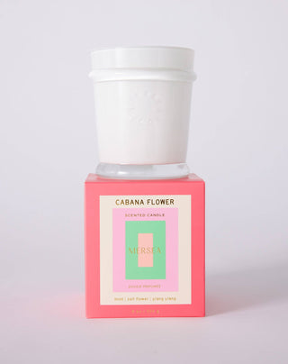 CABANA FLOWER 9 ox candle by Mersea with scents of mint, salt flower and ylang ylang. Light and lovely—like a fresh bouquet—this enchanting fragrance invites you to bask in the warmth of the sun and the alluring embrace of coastal blooms. 