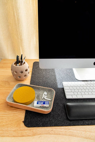 Graf Lantz small natural leather tray with grey felt lining with coasters and desk top accessories.