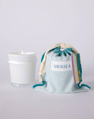 Summer in Provence by Mersea Lavender | Vanilla | Musk Prepare to be transported to the sun-kissed fields of the French countryside, where the light lasts forever and the calming scent of lavender fills the air. Paired with warm vanilla and sensuous musk, this herbaceous yet sweet scent evokes the beauty and serenity of idyllic summers spent in the heart of Provence. 6.5 ounce candles are poured in sheer white glass vessels that can be repurposed. 