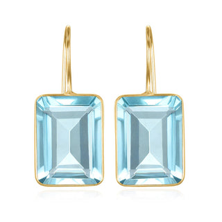 Eye-catching sky blue quartz earrings by Amelia Rose are bezel set on French hook ear wires. 14k gold plated, 1.25" total drop and 5/8" in width.