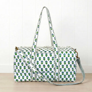 Our new Hydrangea Duffle Bag by Amelia Rose  is guaranteed to catch your eye with its vibrant color and stunning design. Handcrafted for both style and durability, this duffle is perfect weekend getaways, sleepovers, and everything in between. Featuring a green floral pattern with chic interior stripes, it’s made from 100% cotton for a soft, natural feel. -100% cotton -20" W x 10" D x 10" H -2 exterior slip pockets -zip closure.