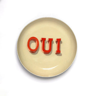 Roomytown round enamel tray with OUI written in the middle of the tray. Perfect for trinkets or jewelry. 