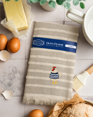 Textured towel with embroidered rooster design on tile by Olive & Loom. 100%cotton