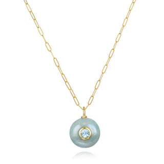 Natural aquamarine is set with bezeled sky blue topaz and dangles from 14k gold filled paperclip chain. Adjusts from 16-18" for a length that works beautifully with layered chokers. A mesmerizing combination of stunning aquamarine and sparkling sky blue topaz. 14k gold dipped sterling silver aquamarine pendant 14k gold filled chain Natural aquamarine & sky blue topaz.