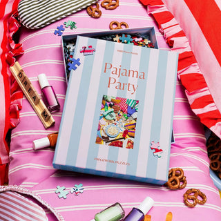 Piecework  Pajama Party is a 1000-piece puzzle, a tribute to everything good about staying up way past bedtime. (Think pizza, popcorn, and cozy chaos.) 