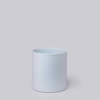Very pale blue cylinder vase with white geometric pattern