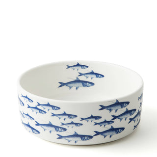 Porcelain pet bowl by Caskata with a school of fish pattern. Dishwasher and microwave safe