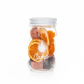 Mason jar of mixed ingredients for craft cocktails.